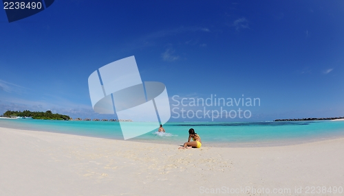 Image of happy young  couple enjoying summer on beach