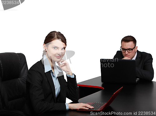 Image of Young Business Couple on Laptops