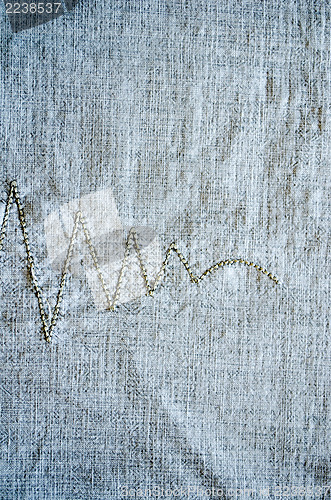 Image of linen background embroider ornament closeup 