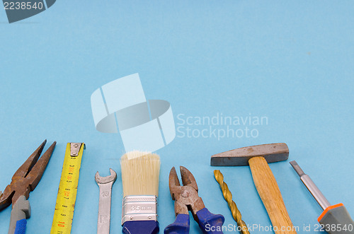 Image of hand work tools set on blue background 