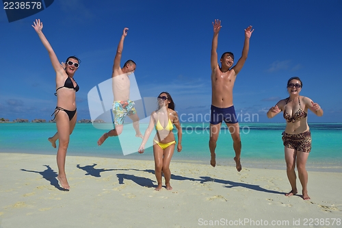 Image of group of happy young people have fun on bach