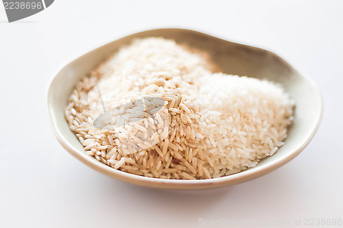 Image of A mound of natural brown and white rice seeds  