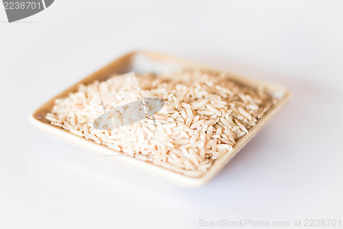 Image of Brown rice cereal food on clean table