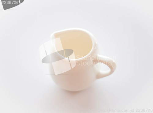 Image of Empty white ceramic pitcher on clean table