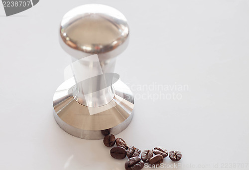 Image of Espresso tamper made from stainless steel on clean table