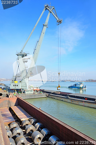 Image of crane and steel plate in harbor