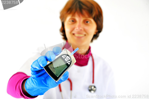 Image of doctor checking diabetic's blood sugar 