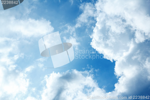 Image of Blue sky with clouds and sun