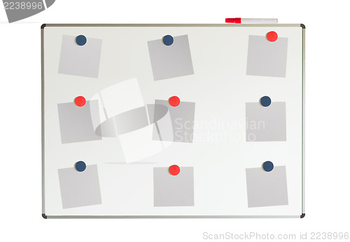 Image of Whiteboard with papers and magnets