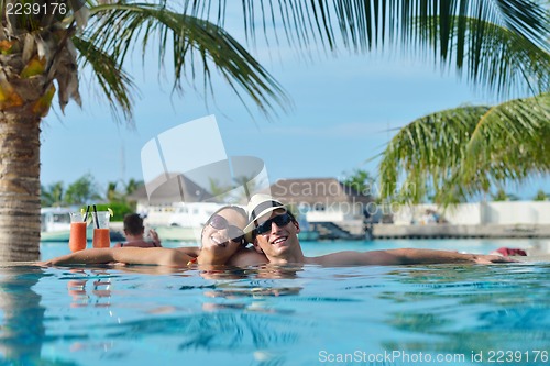 Image of happy young couple have fun on beach