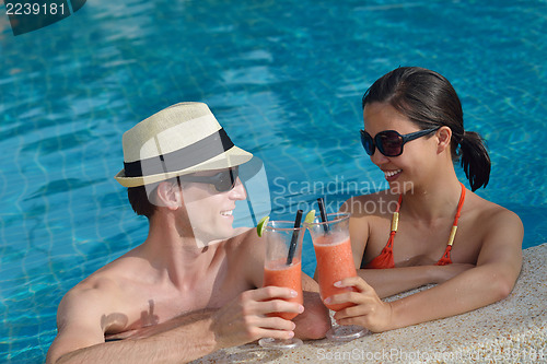 Image of happy young couple have fun on beach