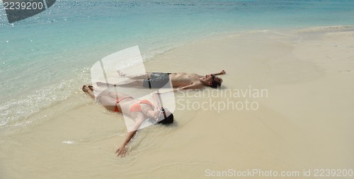 Image of happy young couple have fun on beach
