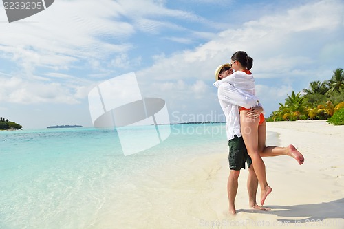 Image of happy young couple have fun on beach