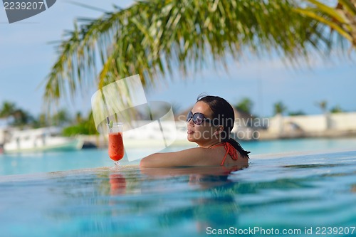 Image of beautiful gril on beach have fun