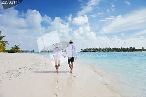 Image of happy young couple have fun on beach