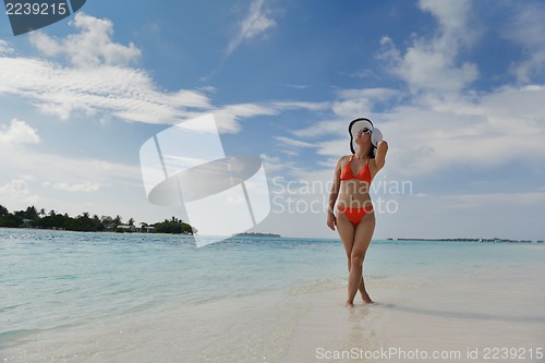 Image of beautiful gril on beach have fun