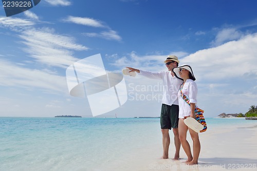 Image of happy young couple have fun on beach