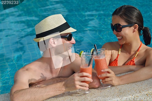 Image of happy young couple have fun on beach