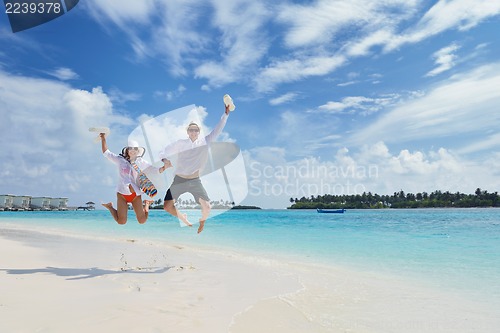 Image of happy young couple have fun on beach