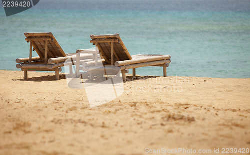 Image of Two bamboo deck chairs in retro style
