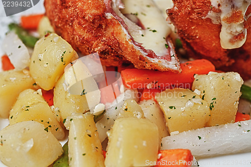 Image of Chicken Cordon Bleu with boiled potatoes