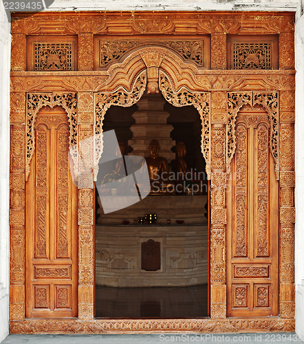 Image of Temple entrance decorated with wooden carvings. Indonesia