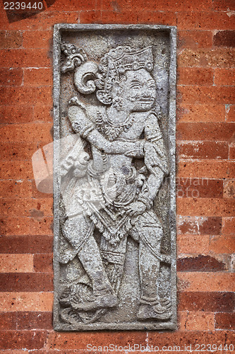 Image of Mythological character on wall of the temple. Indonesia, Bali