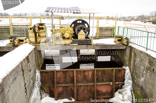 Image of dam mechanism screw hold steel snow water winter 