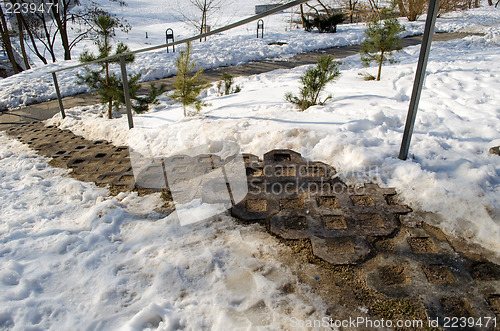 Image of ornamented staircase iron railings around snow 