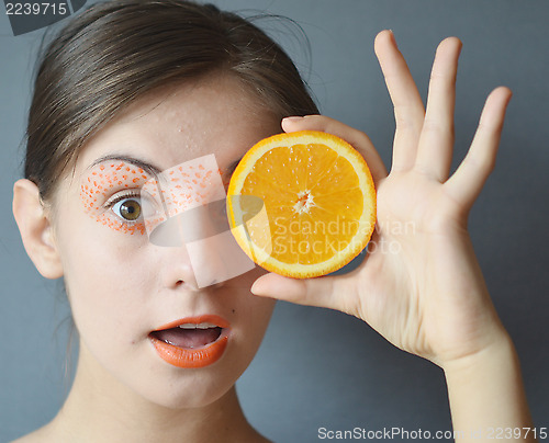 Image of woman with orange