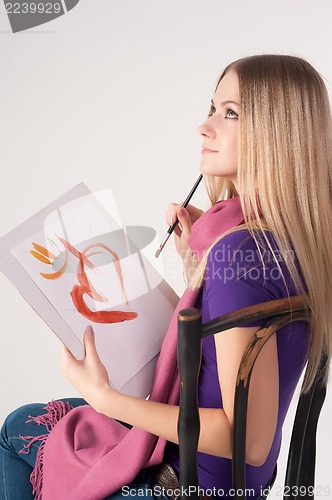 Image of beautiful woman painting