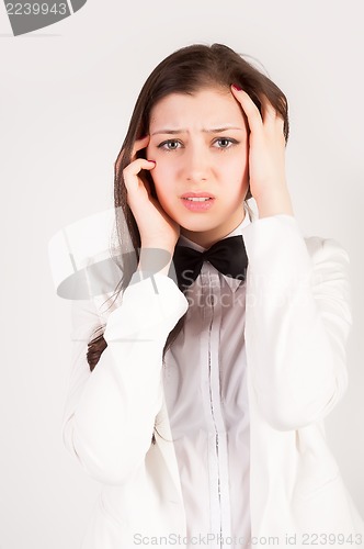 Image of stressed and depressed young businesswoman