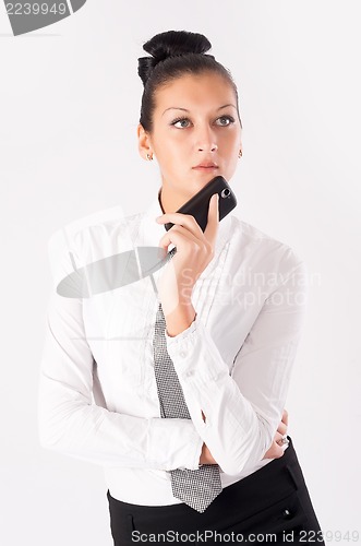 Image of attractive businesswoman with mobile phone