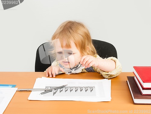 Image of beautiful business girl analyzing chart