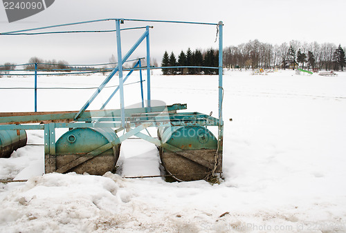 Image of quay pier steel barrel snow lake shore winter 