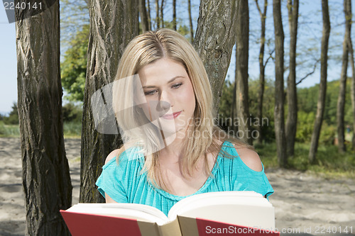 Image of Woman reading a book