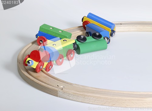Image of colorful wooden toy train and tracks