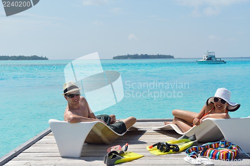 Image of happy young couple have fun on beach