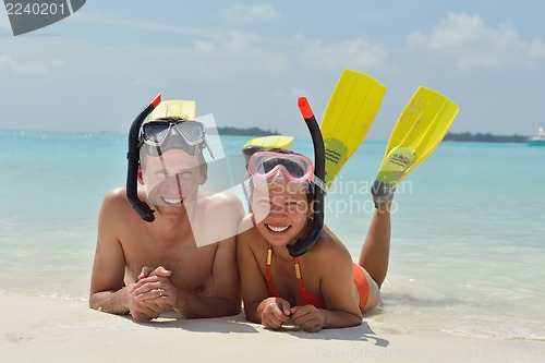 Image of happy young couple have fun on beach