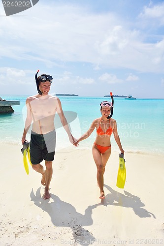 Image of happy young couple have fun on beach