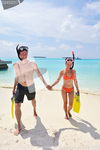 Image of happy young couple have fun on beach