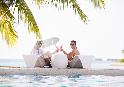 Image of happy young couple have fun on beach