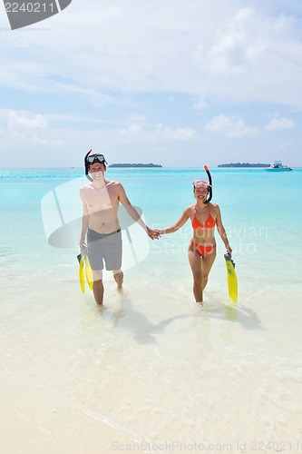 Image of happy young couple have fun on beach