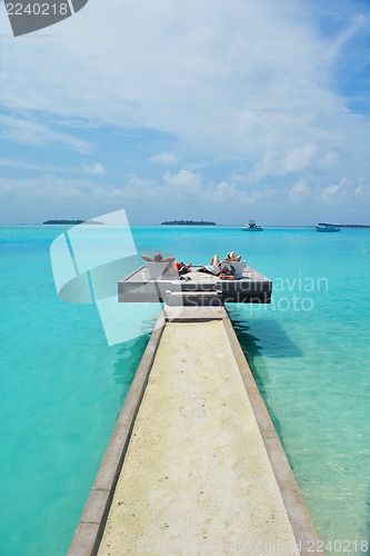 Image of happy young couple have fun on beach