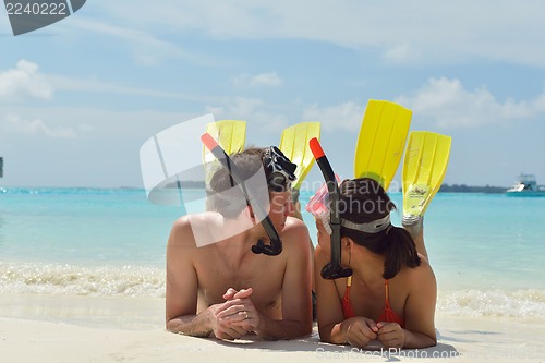 Image of happy young couple have fun on beach