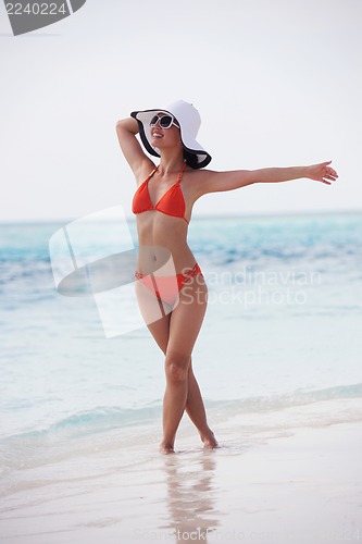 Image of beautiful gril on beach have fun