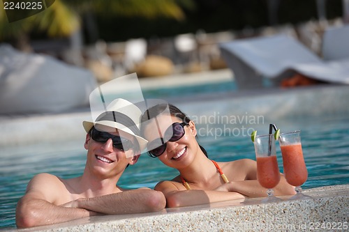 Image of happy young couple have fun on beach