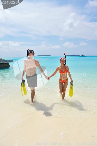 Image of happy young couple have fun on beach