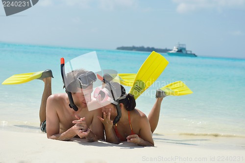Image of happy young couple have fun on beach