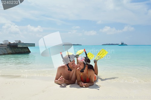 Image of happy young couple have fun on beach